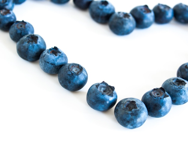 Fresh bluberries from local market on white background. Blueberries contain anthocyanins,  and various phytochemicals, which possibly have a role in reducing risks of some diseases.