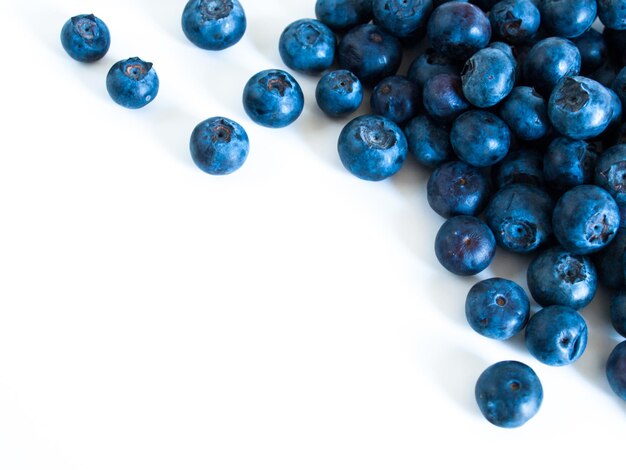 Fresh bluberries from local market on white background. Blueberries contain anthocyanins,  and various phytochemicals, which possibly have a role in reducing risks of some diseases.