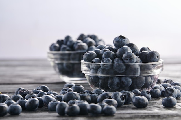 Fresh blueberries in bowls on the table