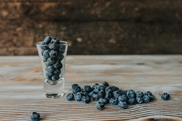 Fresh blueberries filled in a transparent glass