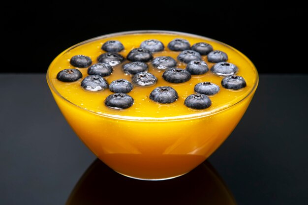 Fresh blueberries in a transparent plate with floral honey. vitamin organic food