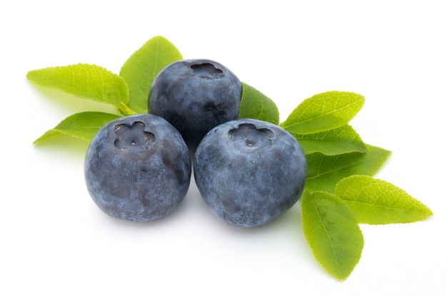 Fresh blueberries on a white surface.