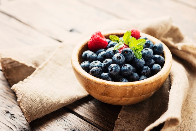 Fresh blueberries in wooden bowl