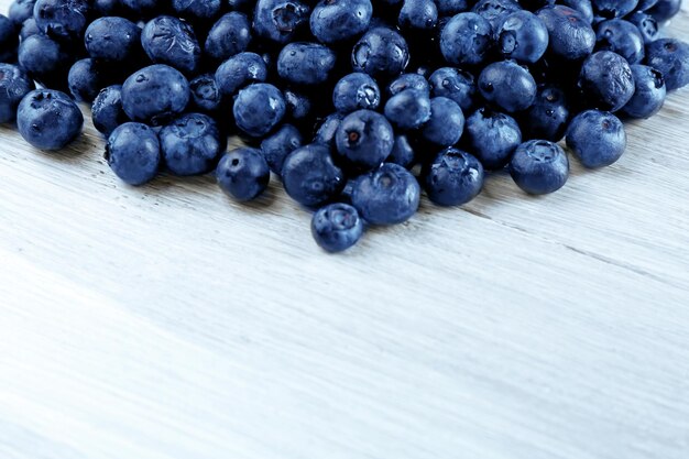 Fresh blueberries on wooden table close up