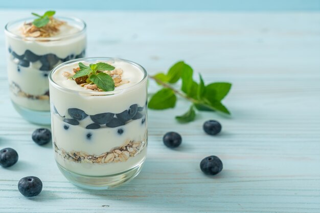 fresh blueberries and yogurt with granola - Healthy food style