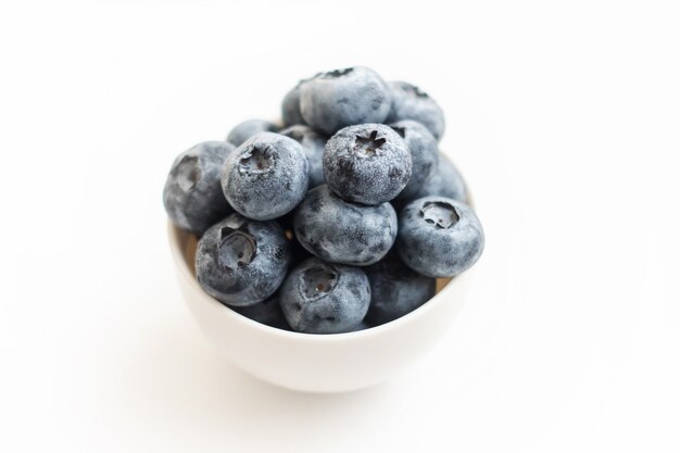 Fresh blueberry close-up isolated on a white background. Shallow depth of field.