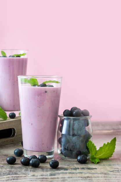 Fresh blueberry smoothie on rustic wood