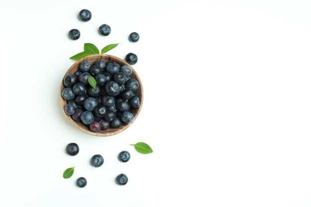 Fresh blueberry with leaves on white