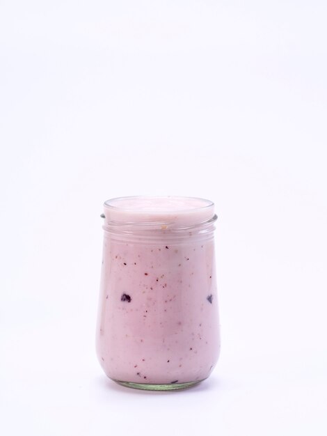 Fresh blueberry yogurt glass on a white background