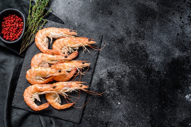 Fresh boiled shrimps on a stone board