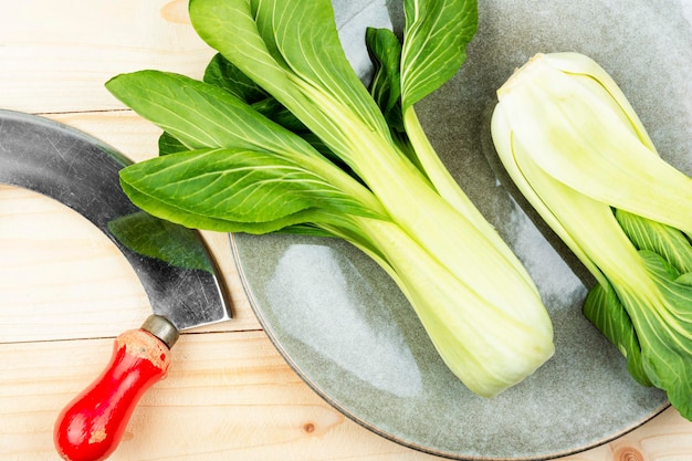 Fresh Bok Choy and knife on the table