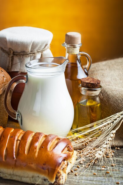 Fresh bread on an old background with kitchen accessories on the table