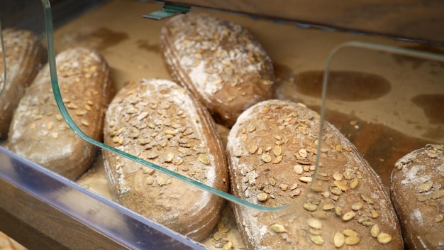 Fresh bread on the shelves of the bakery in the supermarket Shopping at the grocery store Selling food concept