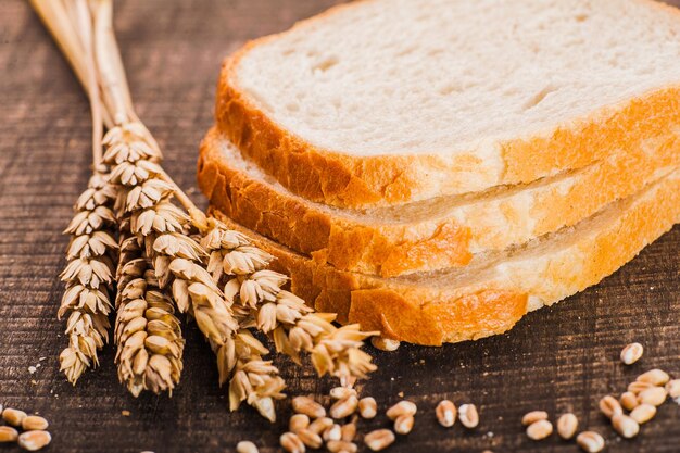 Fresh bread sliced on a wooden board