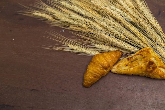 fresh bread and wheat on the wooden