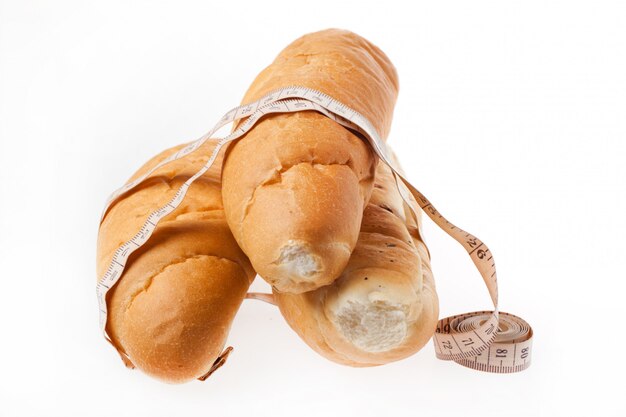 Fresh bread with measuring tape