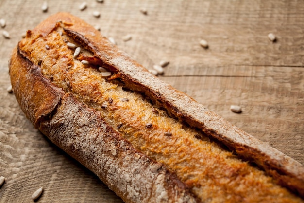 fresh bread on wooden background Freshly baked traditional bread on wooden table fresh baguette