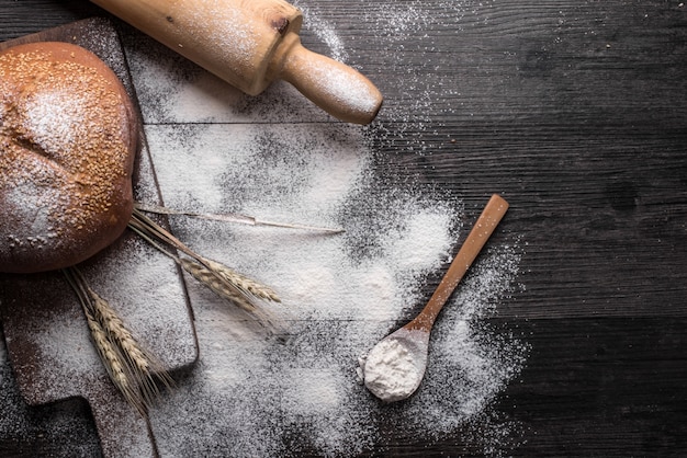 Fresh bread on a wooden background