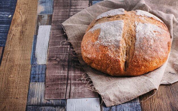 Fresh bread on wooden background