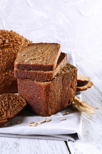 Fresh bread on wooden table close up