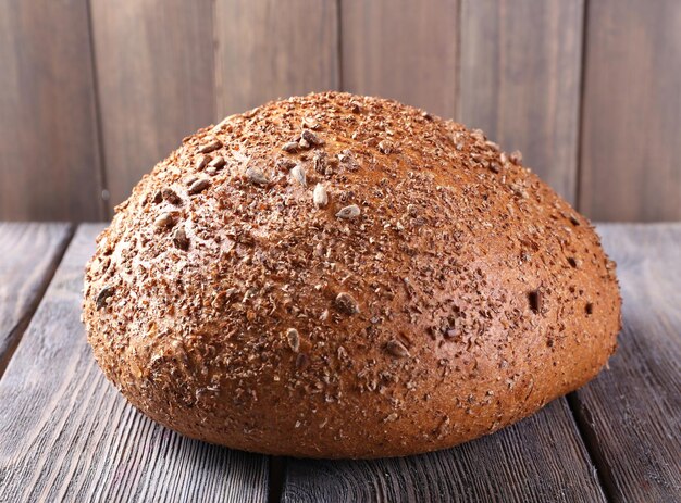 Fresh bread on wooden table close up