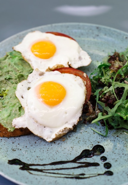 Fresh breakfest, fried eggs and salad