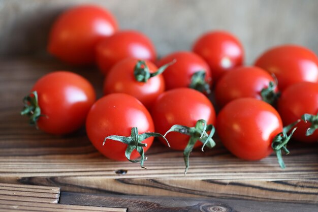 Fresh bright and juicy tomatoes on the kitchen table