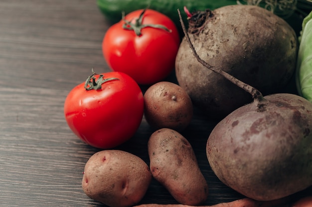 Fresh and Bright Vegetables Lie on the Kitchen Table.