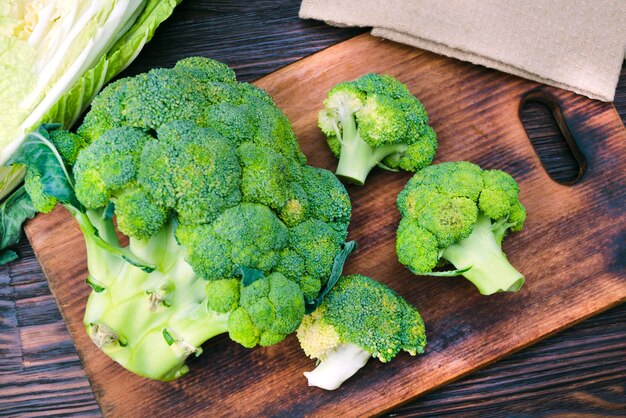 Fresh broccoli on the kitchen board