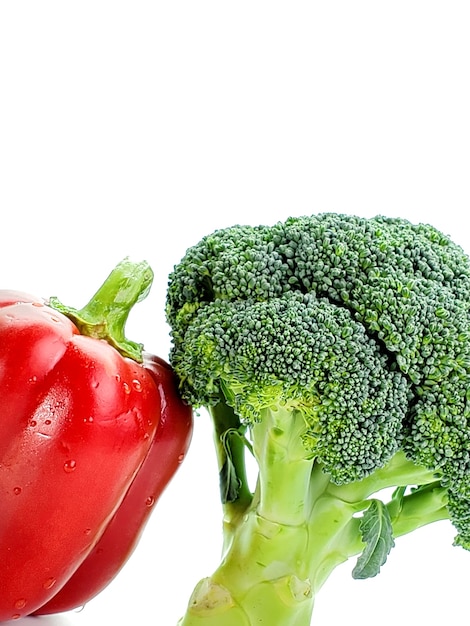 Fresh broccoli and pepper isolated on white