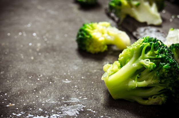 Fresh broccoli on the stone table. Free text space.