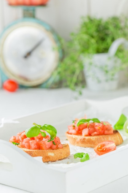 Fresh bruschetta with tomato and basil for breakfast