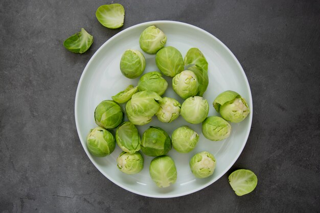 Fresh brussels sprouts in white plate