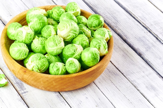 Fresh Brussels sprouts in a wooden bowl
