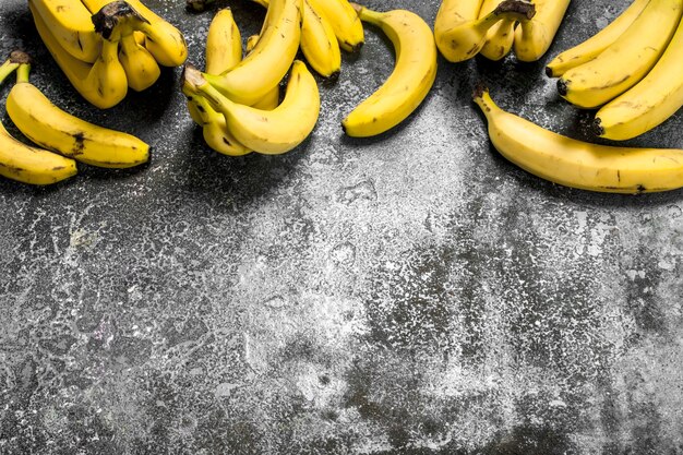 Fresh bunches of bananas. On a rustic background.