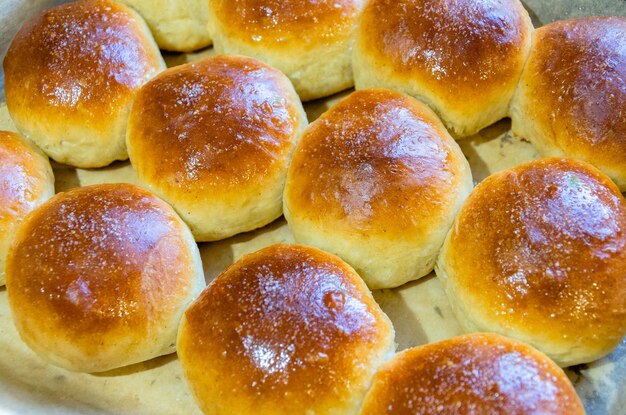 Fresh buns on a baking sheet View from above