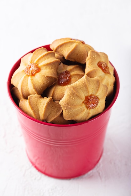 Fresh butter Cookies for Chinese New Year in a red bucket Shortbread kurabye