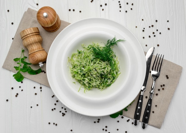 Fresh cabbage and cucumber salad with dill in bowl