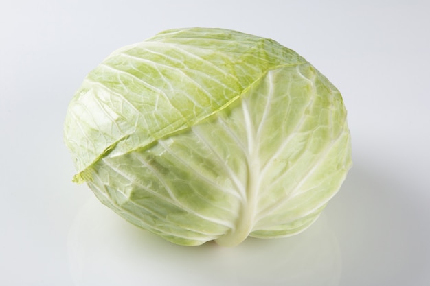 Fresh cabbage isolated on white surface.