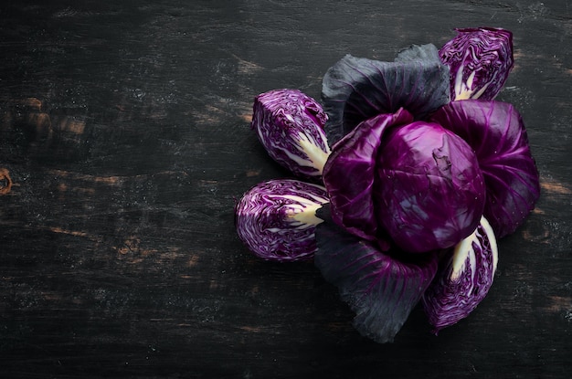 Fresh cabbage Purple cabbage on a black background Organic food Top view Free space for your text