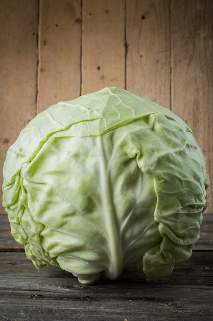 Fresh cabbage on rustic table