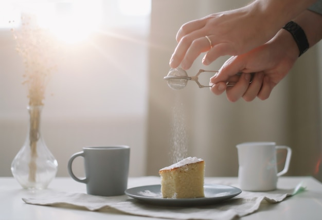 Fresh cake pitcher and cup of coffee