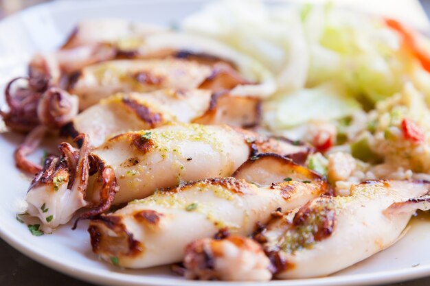 Fresh calamari served in an old Italian restaurant (Tuscany). Daylight.