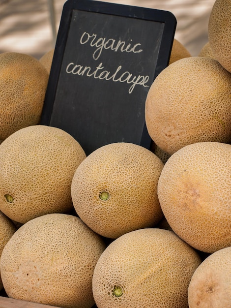 Fresh cantaloupe at the local farmers market. Farmers markets are a traditional way of selling agricultural products.