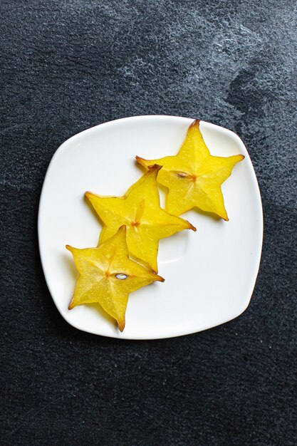 fresh carambola star fruit cut into slices ready to eat