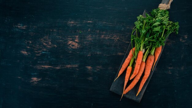 Fresh Carrot Fresh vegetables On a wooden background Top view Copy space