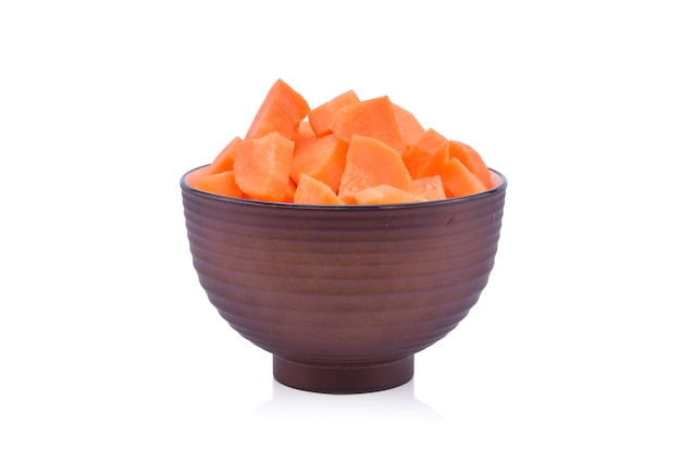 Fresh carrots in bowl isolated on white background