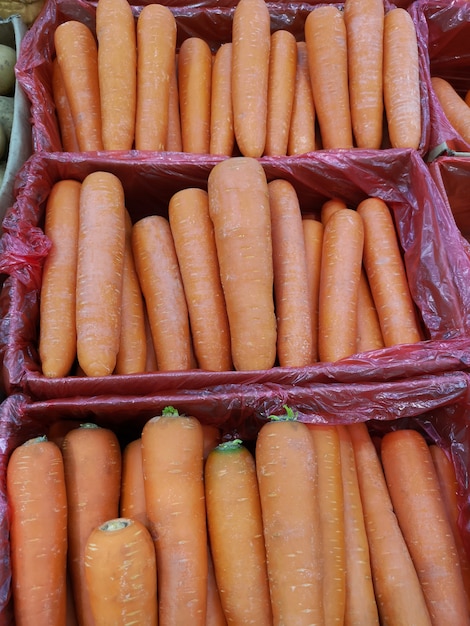 Fresh carrots for sale on the market. soft focus.