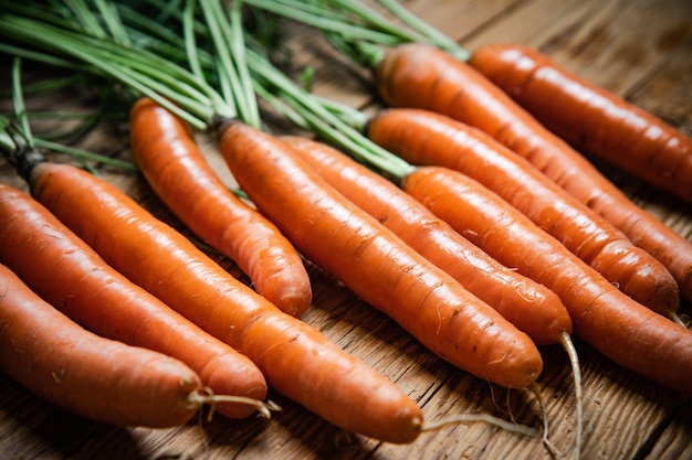 Fresh carrots on a wooden table