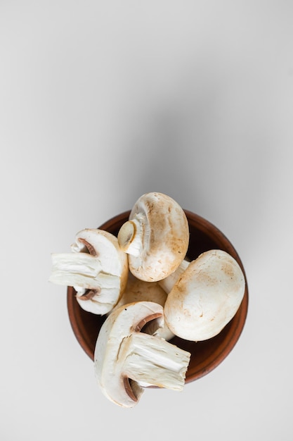 Fresh champignon mushrooms isolated on white background